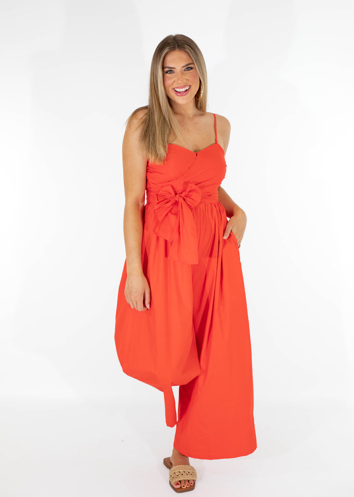 red orange jumpsuit with bow tie front and removable straps