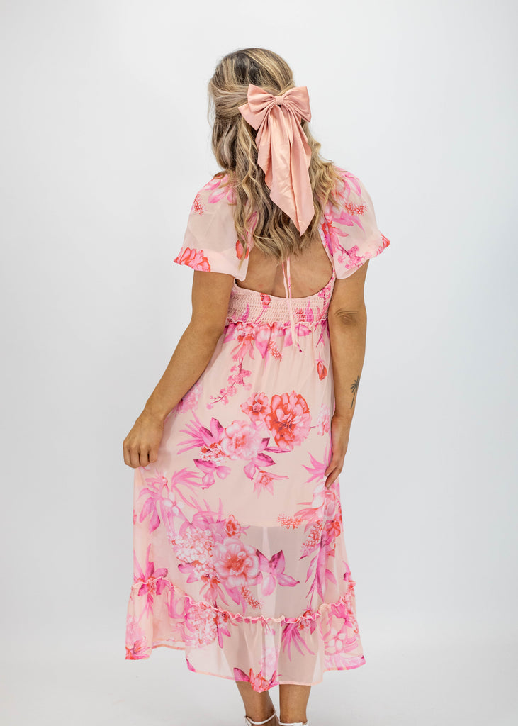 pink floral midi dress with puff sleeves, open back and smocked chest