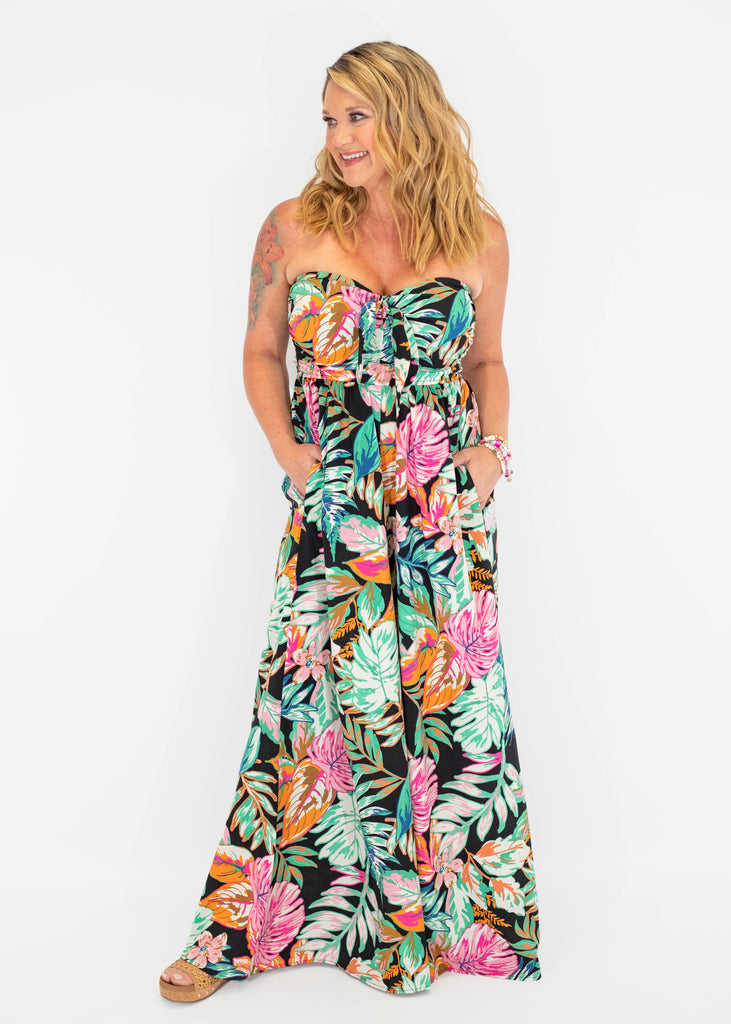 black strapless jumpsuit with colorful tropical print