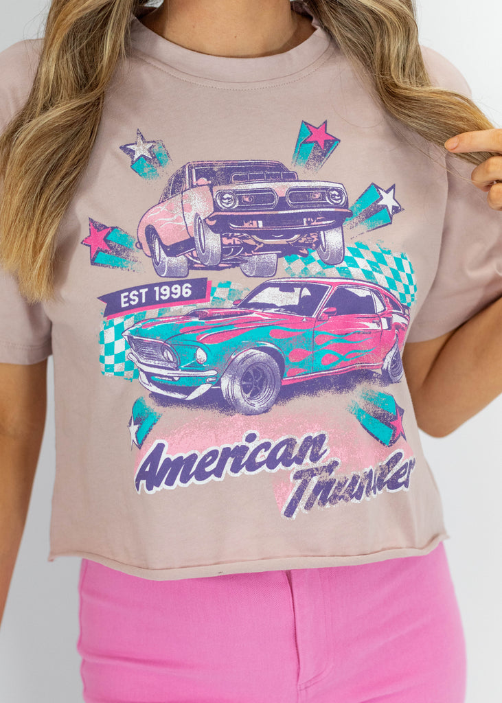pale pink, car graphic with pink, teal and purple colors, cropped