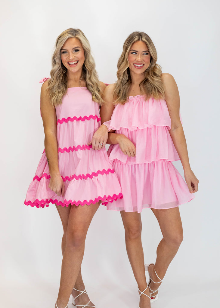 light pink babydoll fit mini dress with tie straps and hot pink scallop details