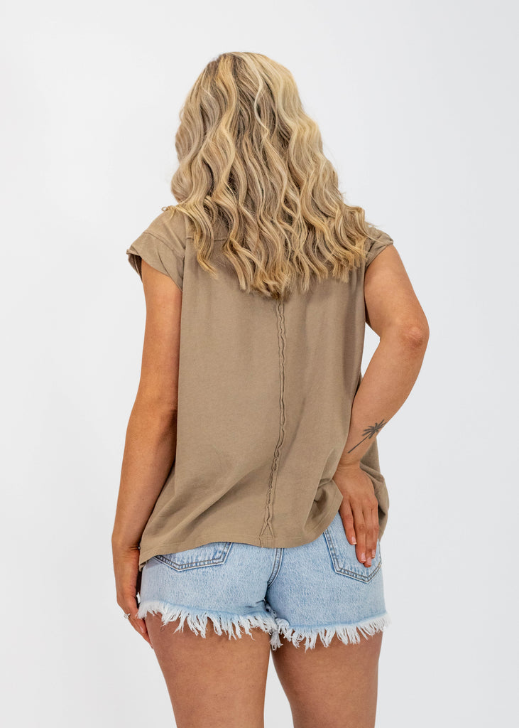 light brown top with rolled seams