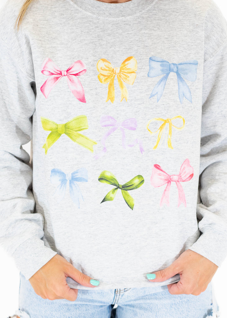 grey crewneck with colorful bows