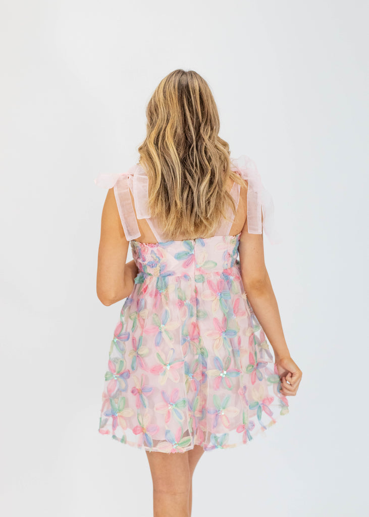 blush babydoll fit mini dress with pastel multi-color flower designs