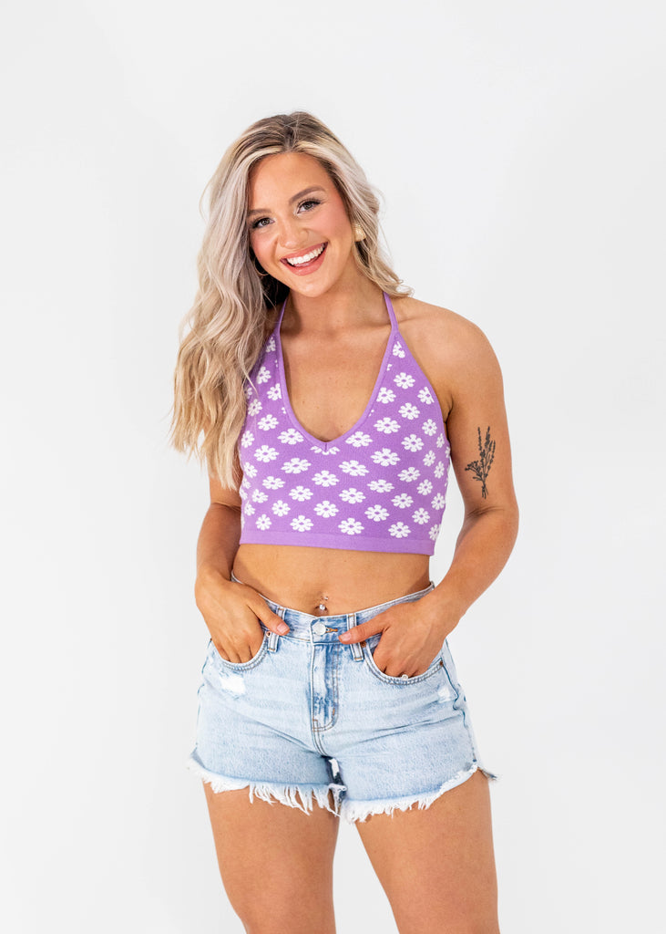 purple cropped halter top with white flowers