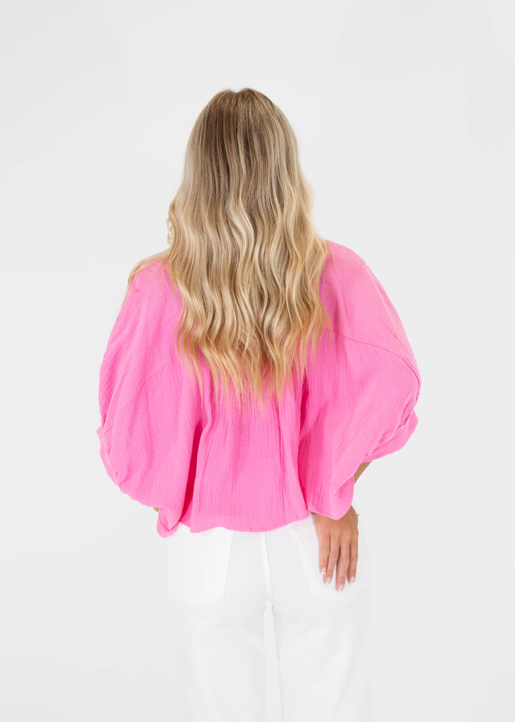 pink cropped button down shirt