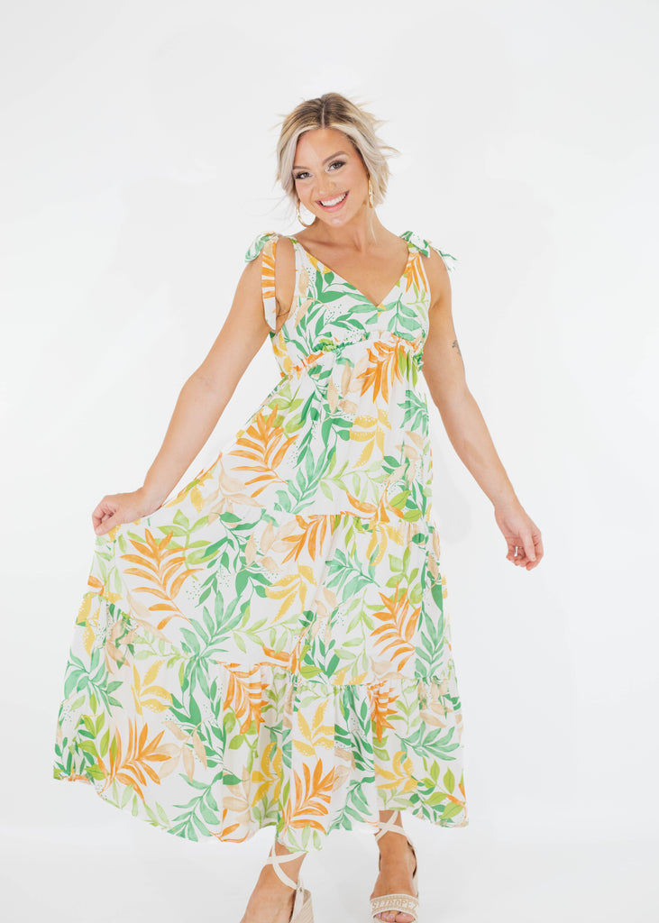 white maxi dress with green and orange floral