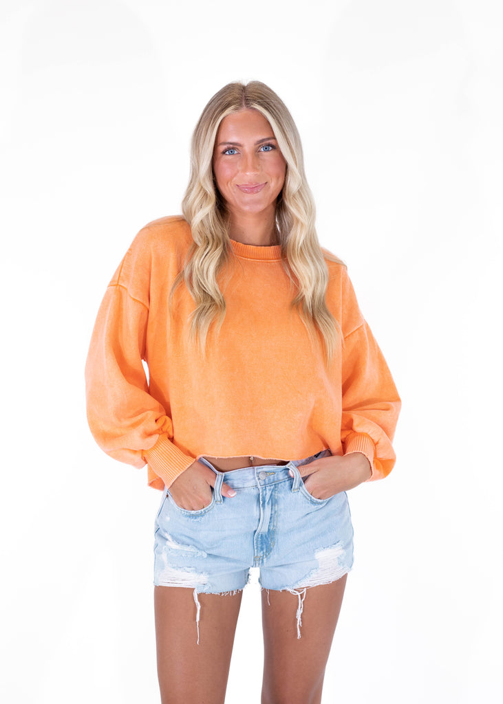 cropped orange sweatshirt