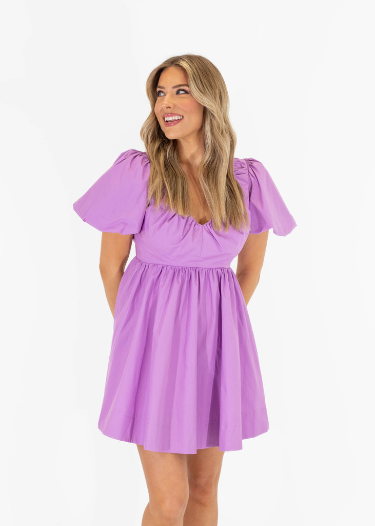 purple dress with puff sleeves and open back
