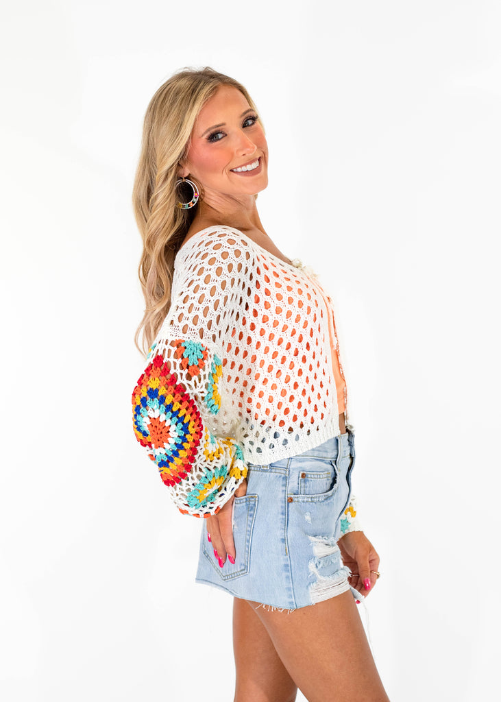 open knit tie cardigan with multi-color floral sleeves