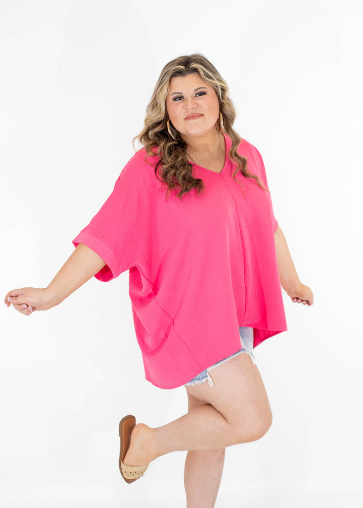 hot pink v-neck top with short sleeves