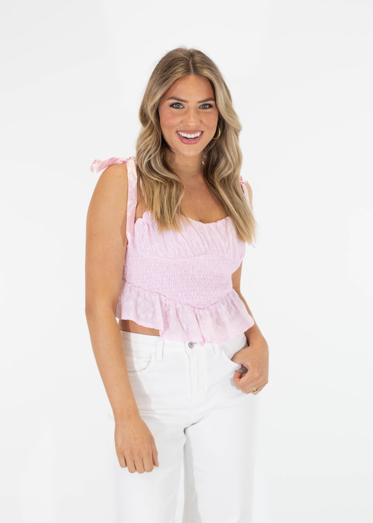 light pink shirred top with tie straps ruffle bottom