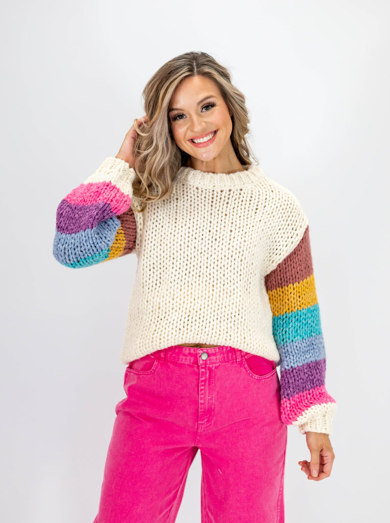 cream knit sweater with multicolor sleeves