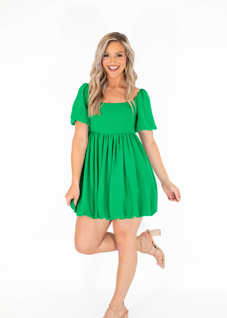 green mini dress with puff skirt and sleeves