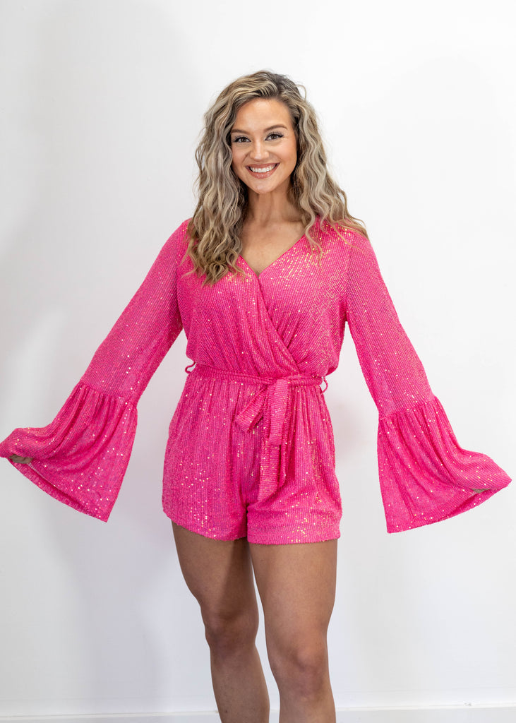 hot pink sequin belted romper with flare sleeves and v-neck