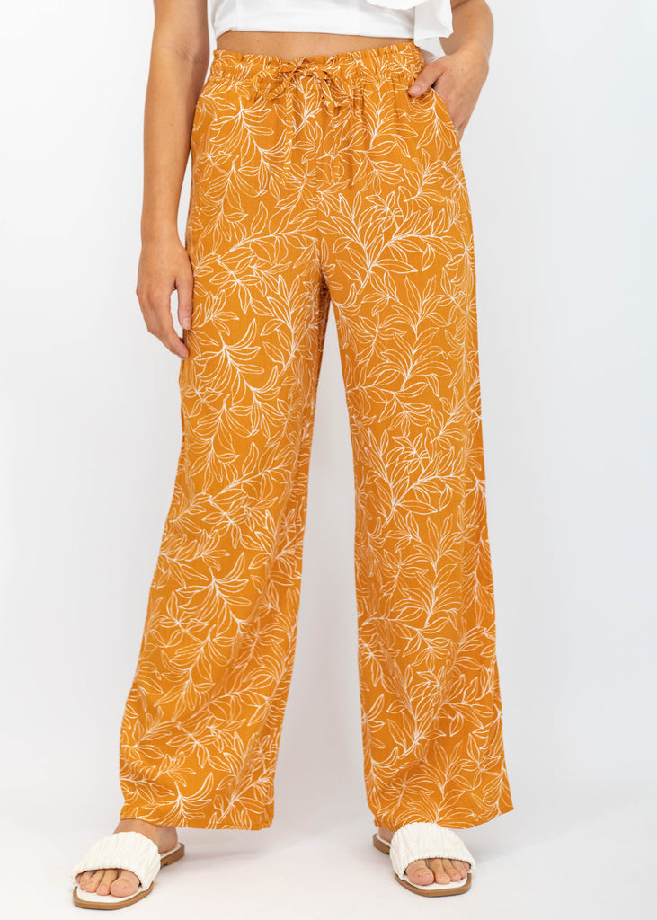 yellow flowy pants with white floral print