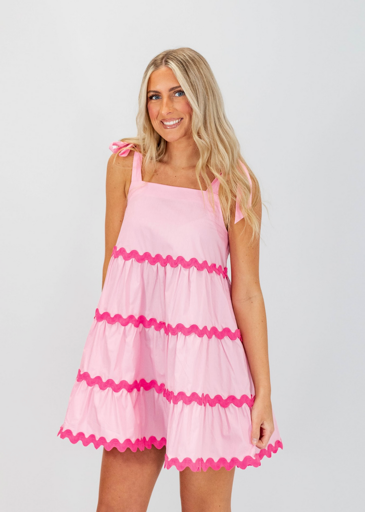 light pink babydoll fit mini dress with tie straps and hot pink scallop details