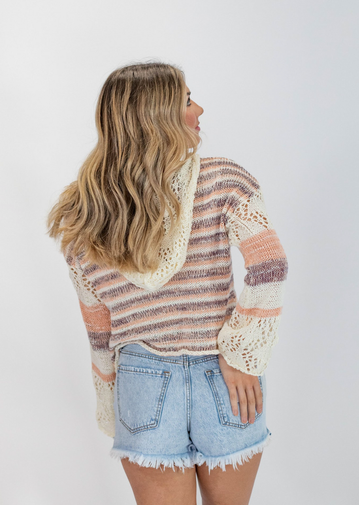 cream knit cropped hooded sweater with light orange and dark purple stripes