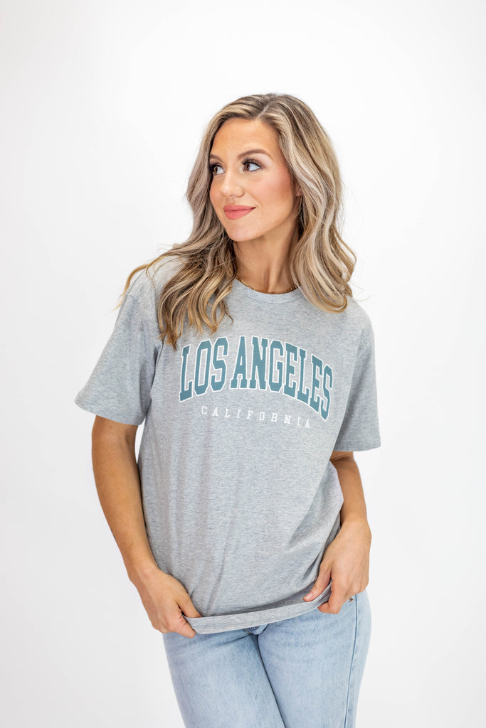 gray tee with "Los Angeles" print